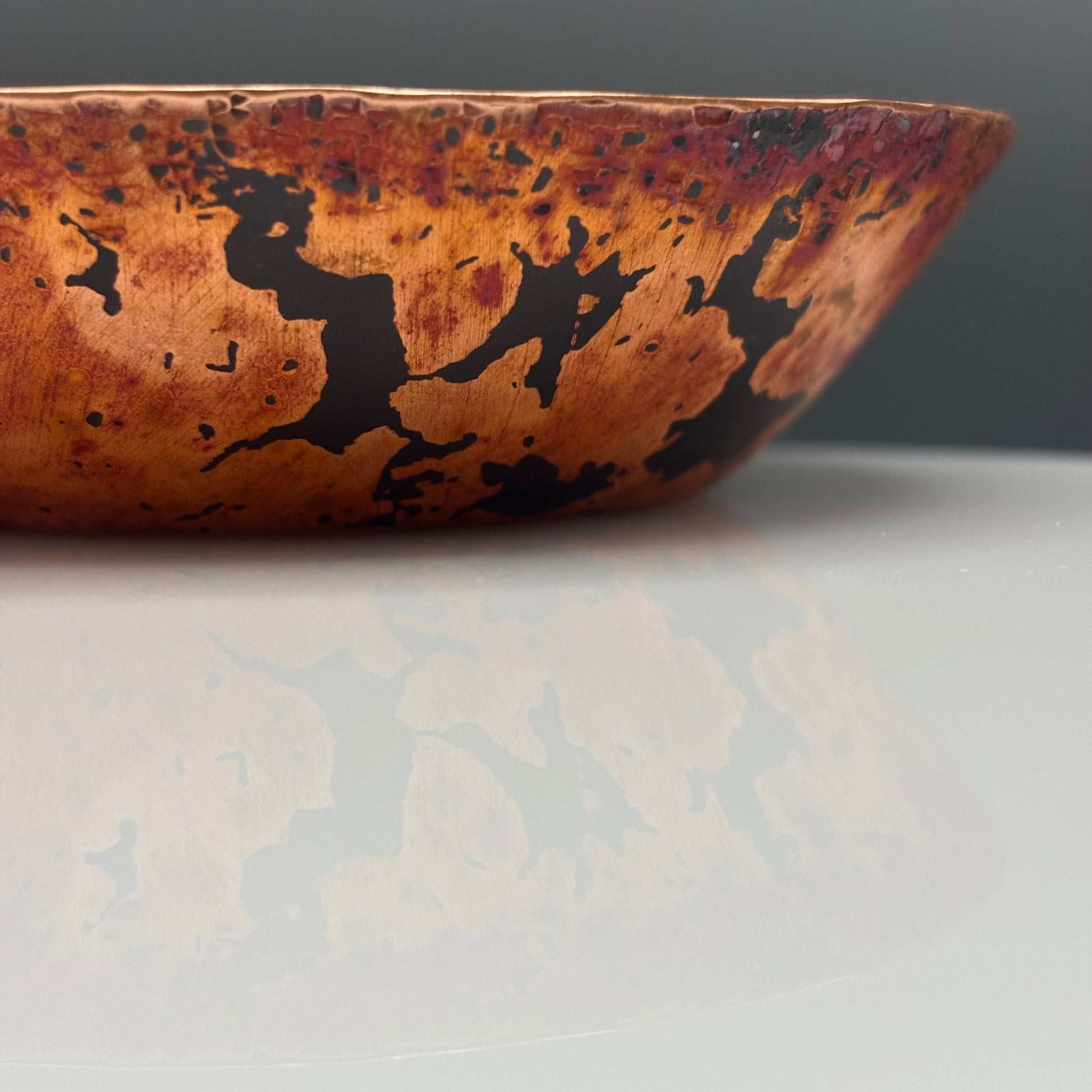 Cruan Marino Small Enamelled Copper Bowl Soft White II, side view of raw copper exterior with dark oxide markings