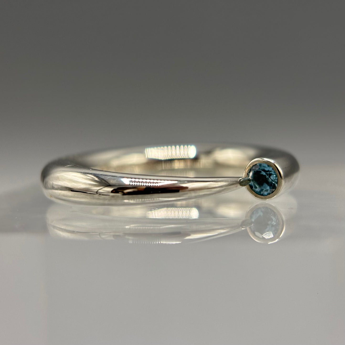 Paul Finch - Ring: 4mm tapering silver with blue topaz