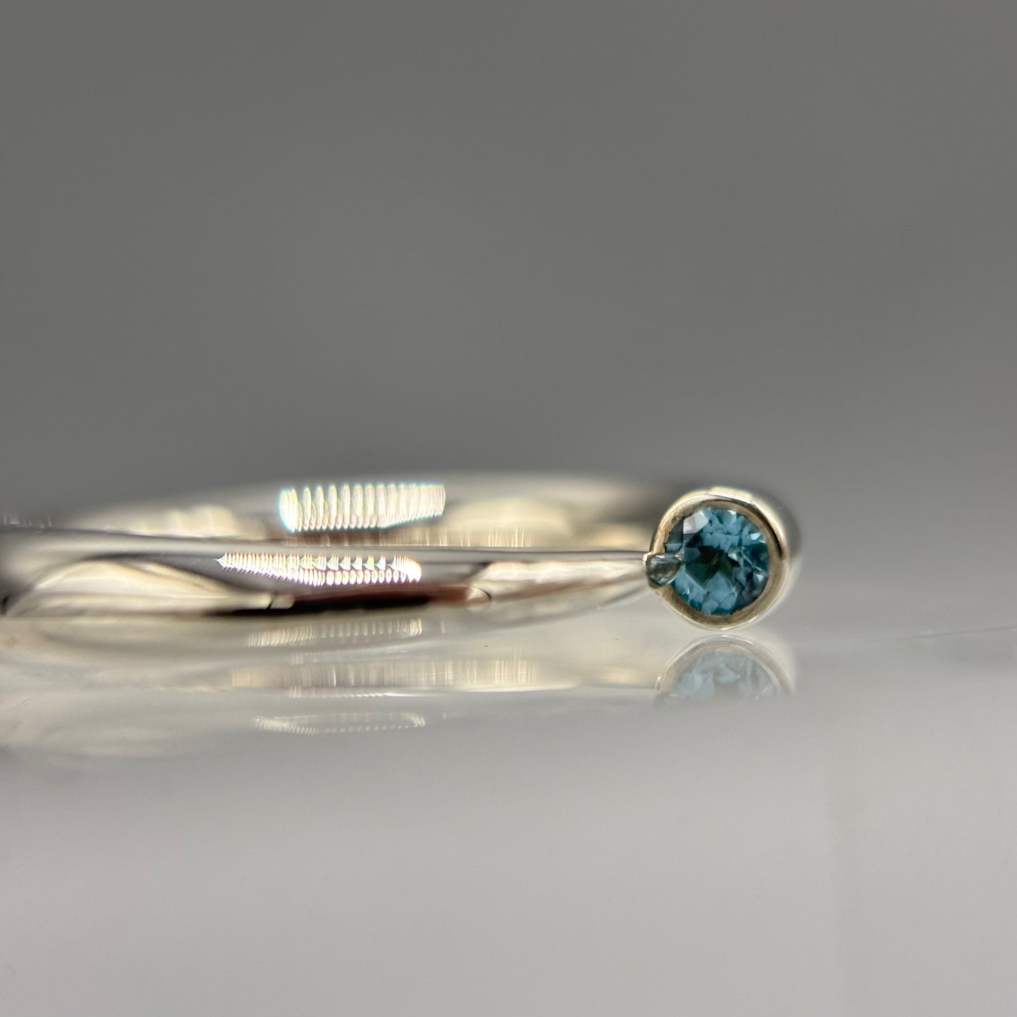Paul Finch - Ring: 4mm tapering silver with blue topaz