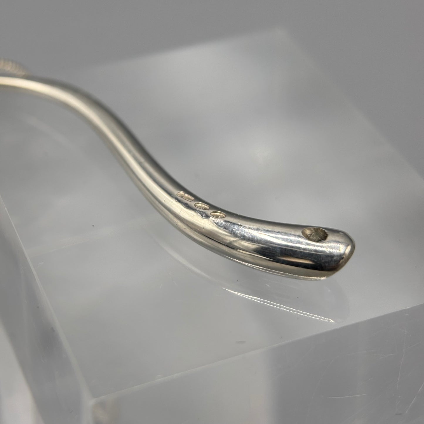 Paul Finch - Pendant: Curving solid silver with blue topaz & solid 18ct Yellow Gold bead